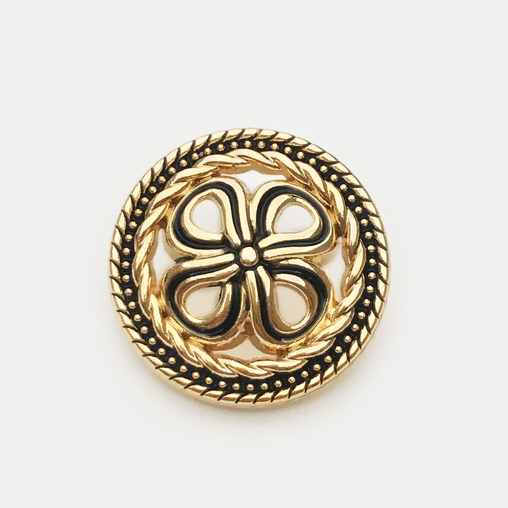 Gold hollow four-leaf clover metal button with black outline center detail