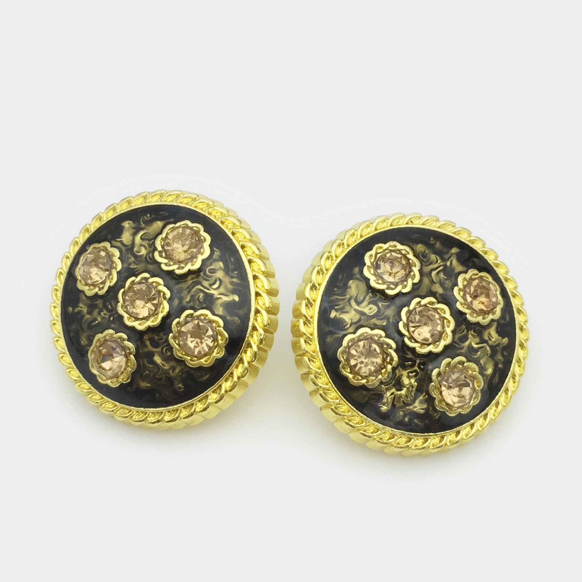Gold metal coat button pair, round black base with ornate floral diamond rhinestones