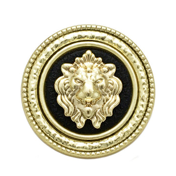 Gold lion-head round metal button with black center, ornate rim