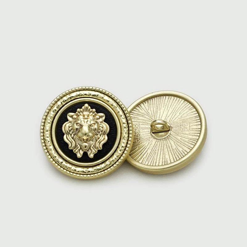 Gold round lion-head metal button with black center, view of back shank