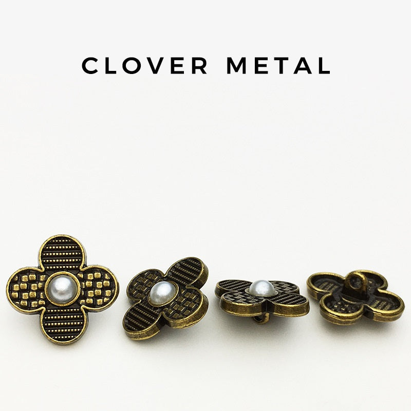 Assorted four-leaf clover metal buttons with faux pearl centers, gold-tone and dark accents