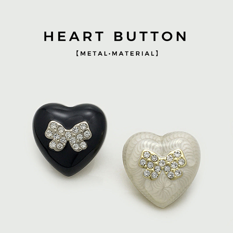 Black and white heart-shaped beaded metal buttons with crystal bow details
