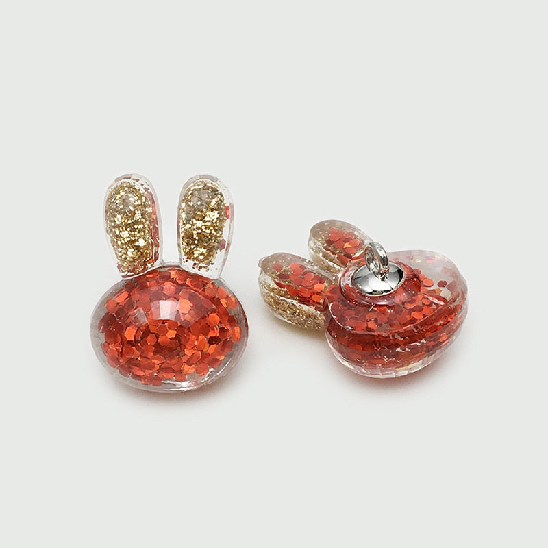 Red glitter rabbit-ear resin buttons with gold speckled ear centers, 2-pack