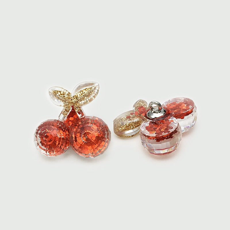 Red glitter resin bow buttons with gold ear accents and knot-like center, 2-pack