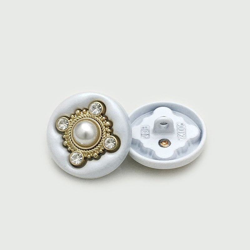 Round four-leaf clover sewing button, faux pearl center with crystals, gold-tone edge; back shown