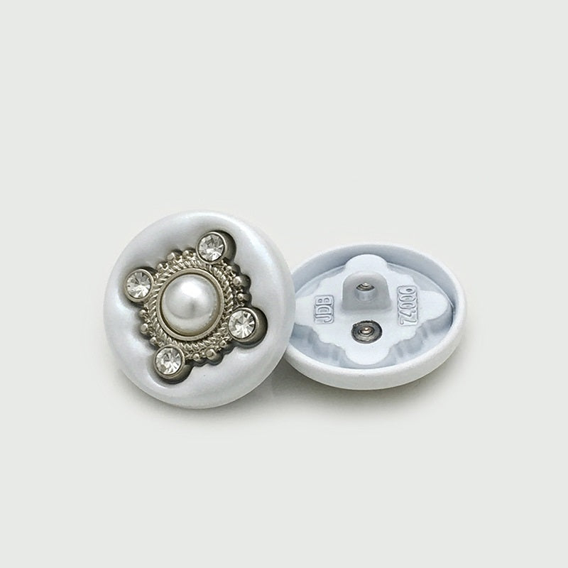 Round four-leaf clover sewing button with faux pearl and crystal accents, silver-tone edge; back shown