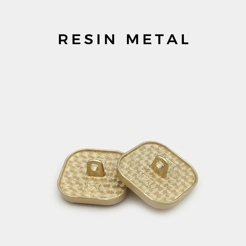 Square resin buttons, metal shank backs; gold-tone textured base