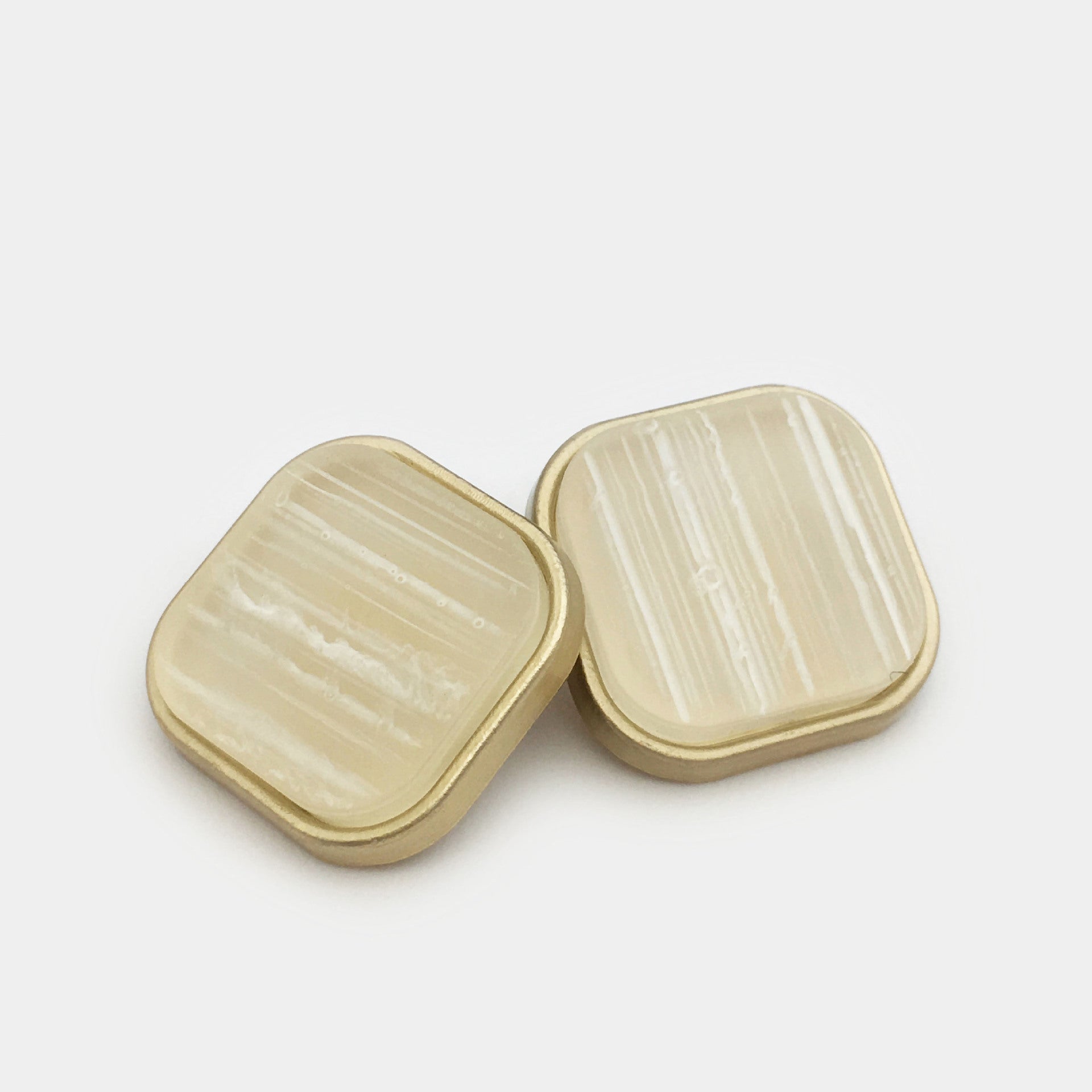 Square resin alloy buttons with handle, khaki/cream striped front; gold-tone edges