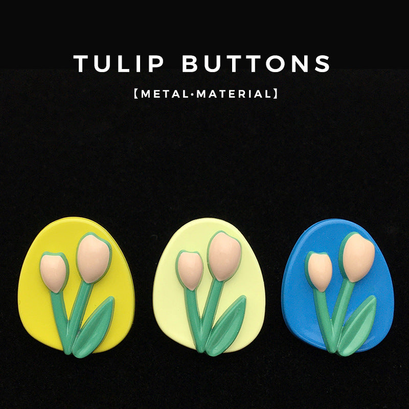 Oval tulip metal buttons, yellow, cream and blue tulip faces with green leaves