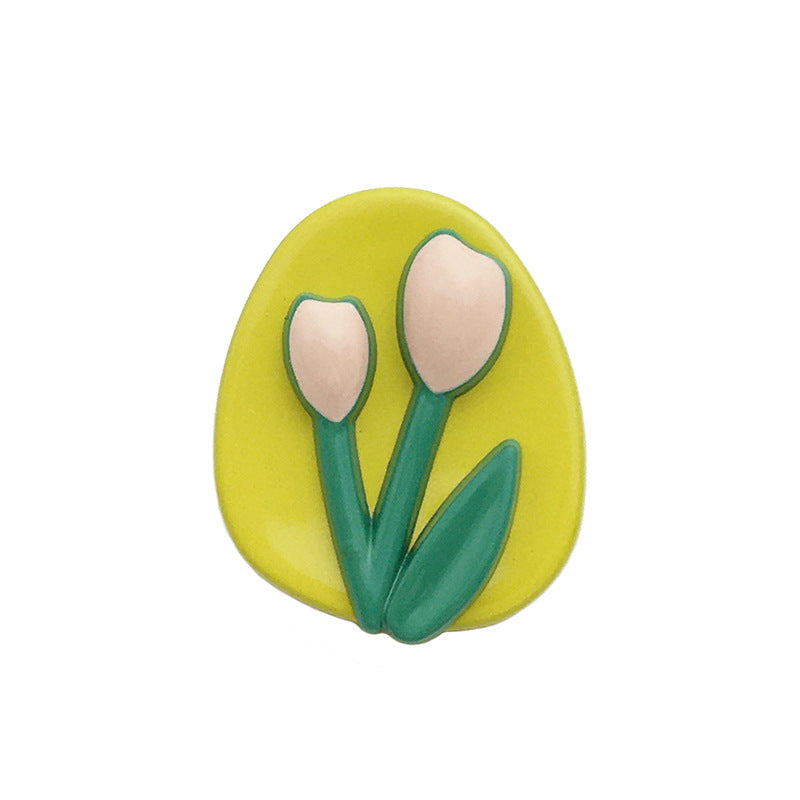 Oval tulip metal button, yellow face with green stems and pink tulip petals