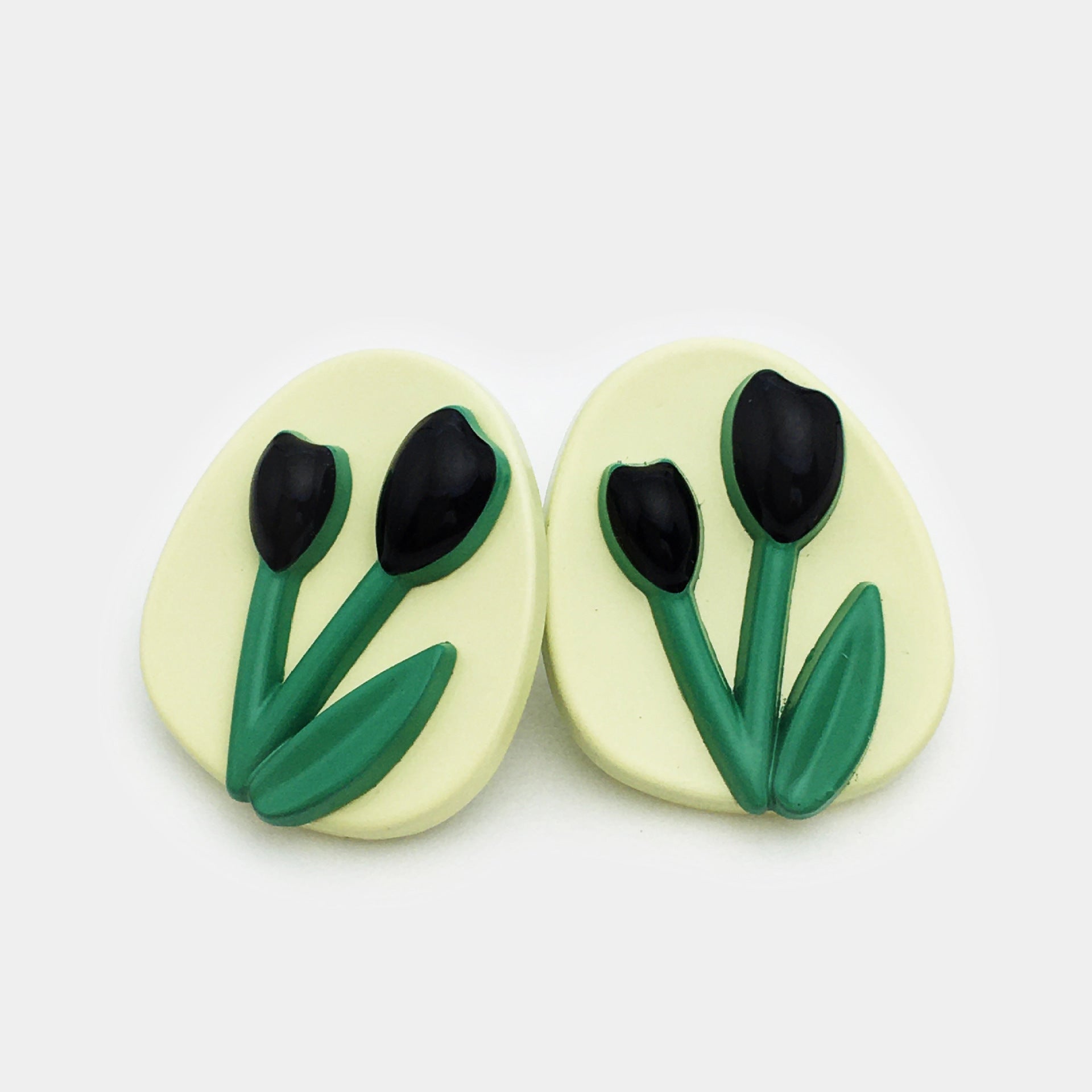 Oval tulip metal buttons, cream face with black tulip petals and green stems