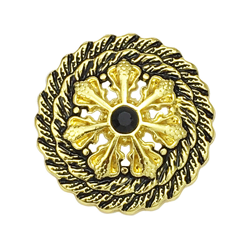 Antique gold hollow flower metal button with black center, front view