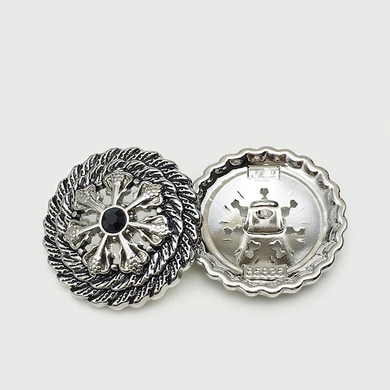 Silver hollow flower metal button, back view with mounting holes and stamp