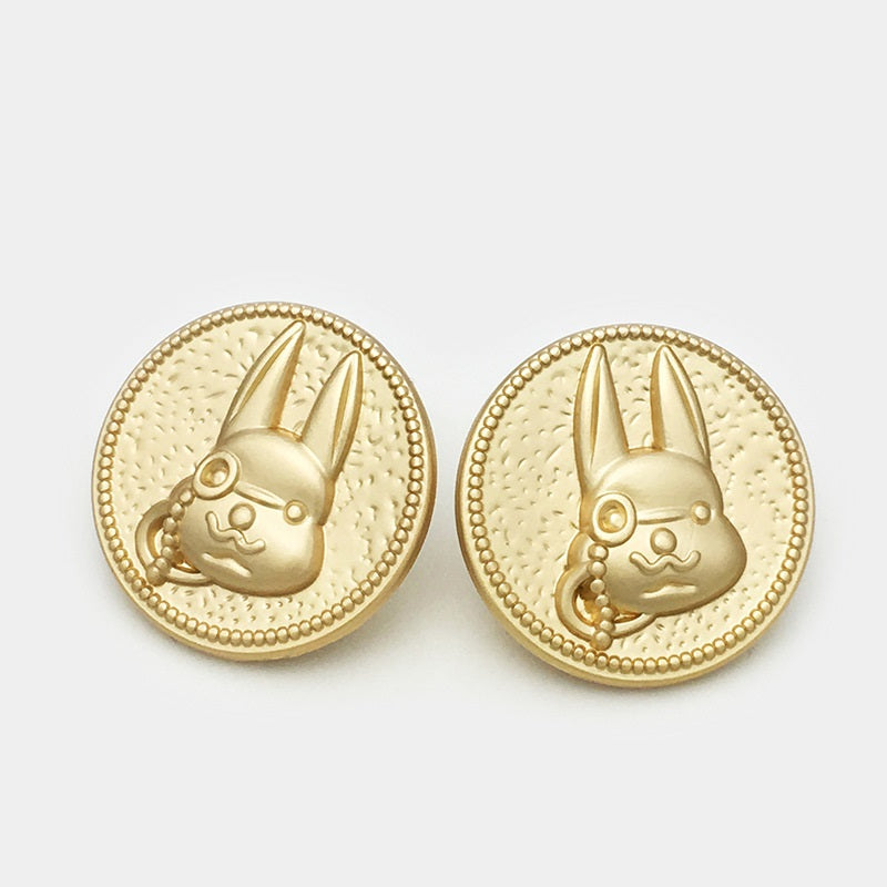 Gold-tone rabbit metal button backs showing metal loop shank