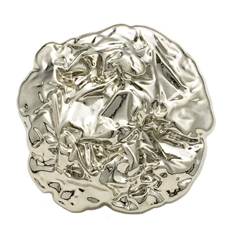 Oversized irregular metal button, silver tone, textured raised surface, front view