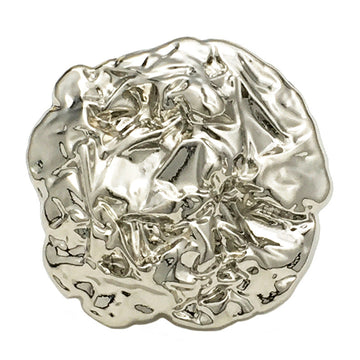 Oversized irregular metal button, silver tone, textured raised surface, front view