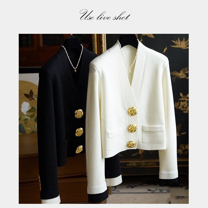 Golden irregular metal buttons on blazer front, round textured embossed design