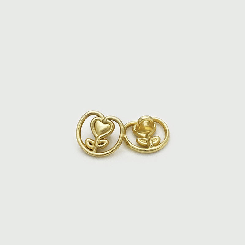 Gold heart tulip metal button pair, raised heart and flower motif in circle