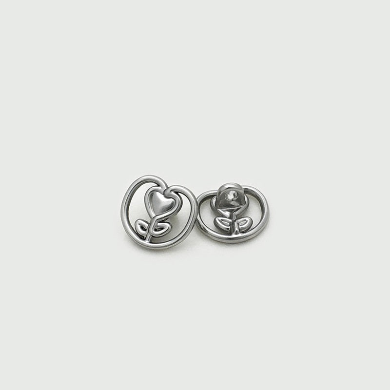 Silver heart tulip metal button pair, raised heart and flower motif in circle