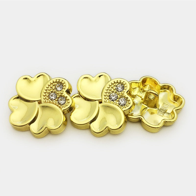 Gold four-leaf clover metal buttons with rhinestone-embellished center and shank backs
