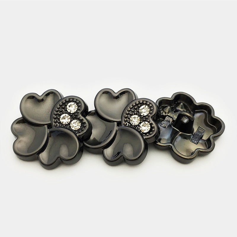 Gunmetal four-leaf clover metal buttons with rhinestone-embellished center and shank backs
