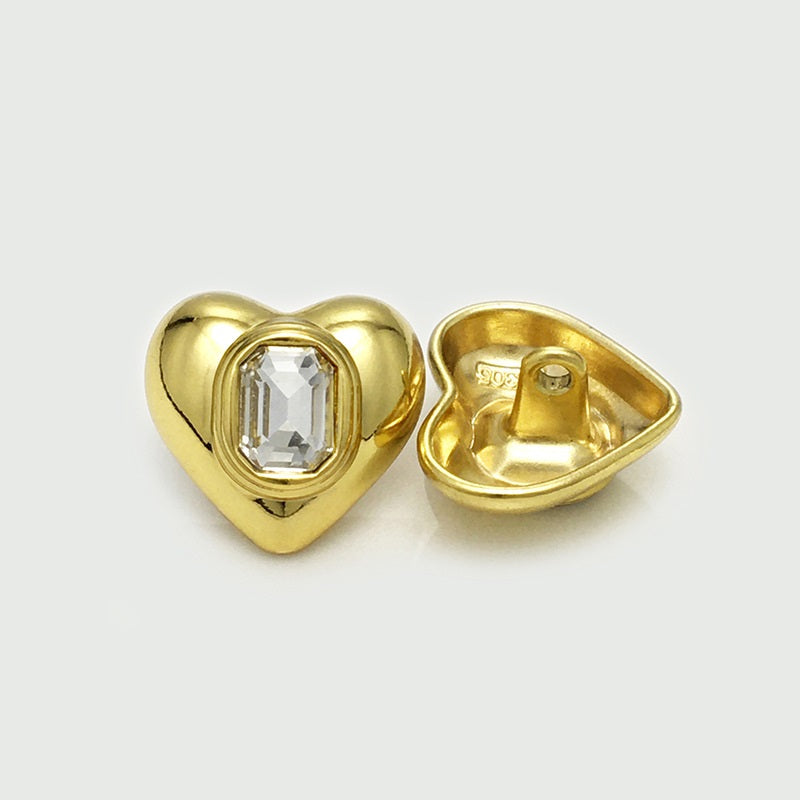 Gold heart-shaped metal button front and back, square crystal center