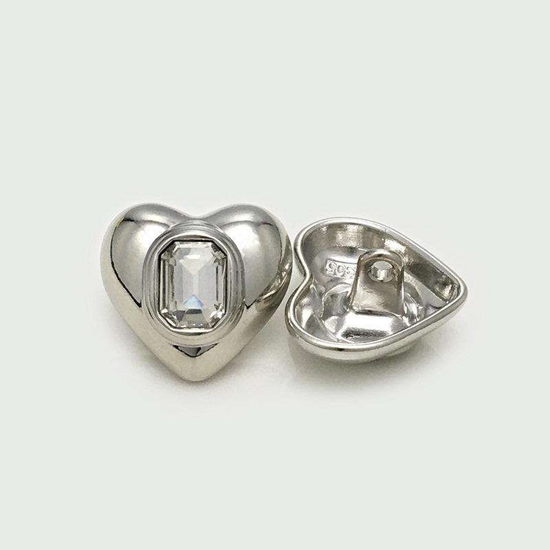 Silver heart-shaped metal button front and back, square crystal center