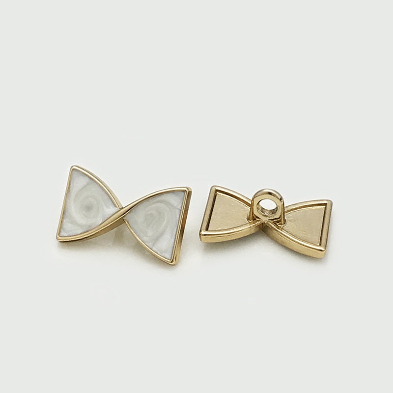 Bow-knot metal button with shank, gold tone, 17x10mm
