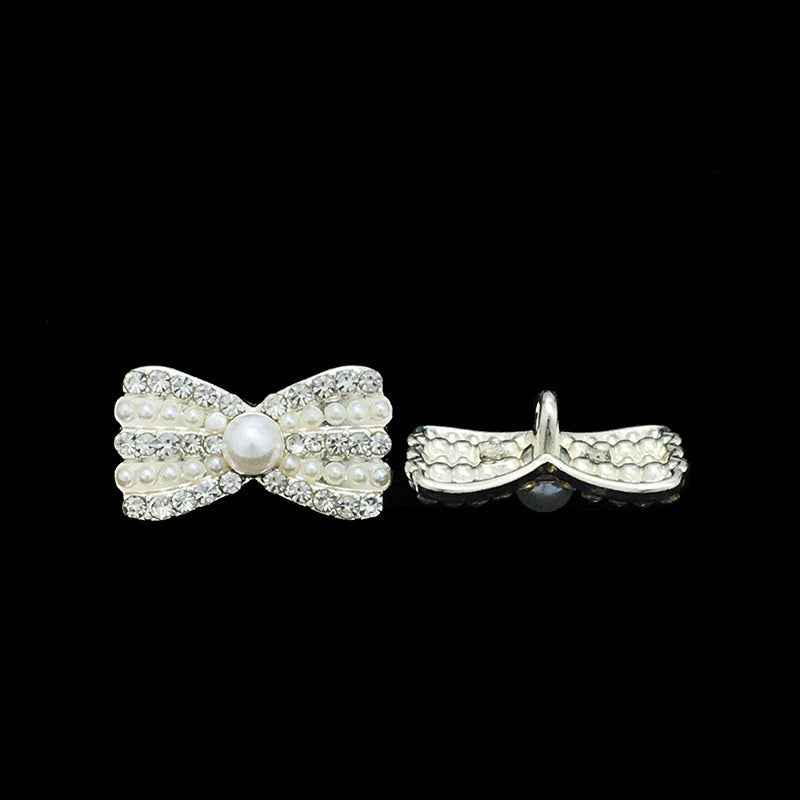 Pearl bow metal button side view with faux pearl rows, rhinestone trim, loop