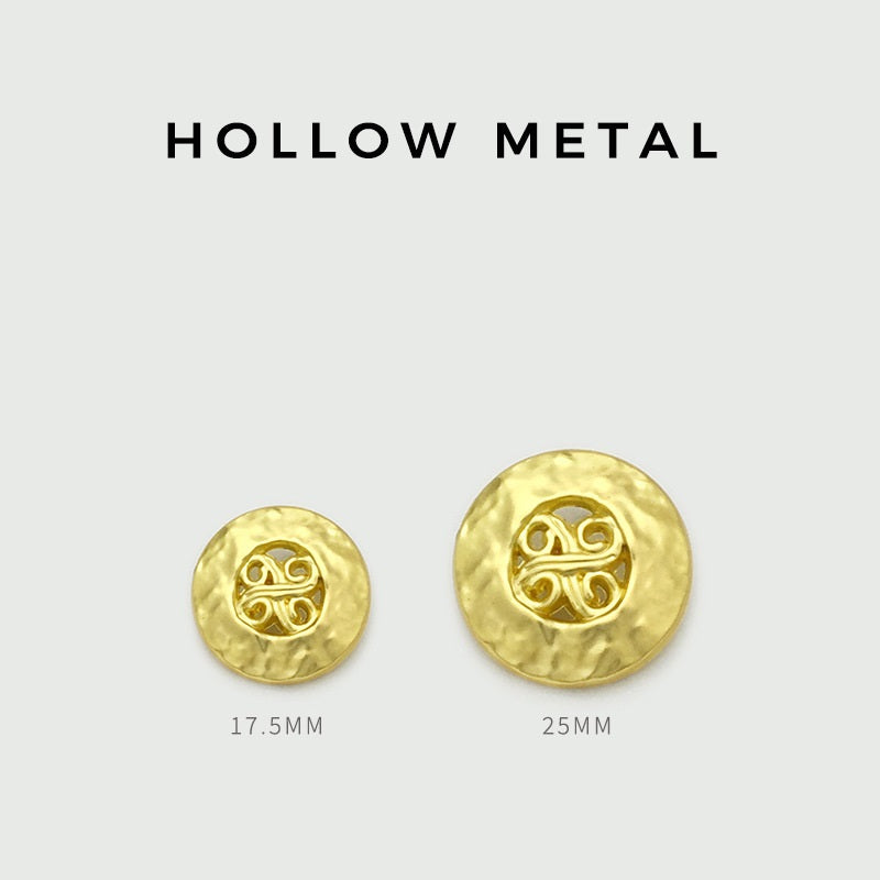 Golden vintage metal buttons in two sizes, embossed swirled motif on front