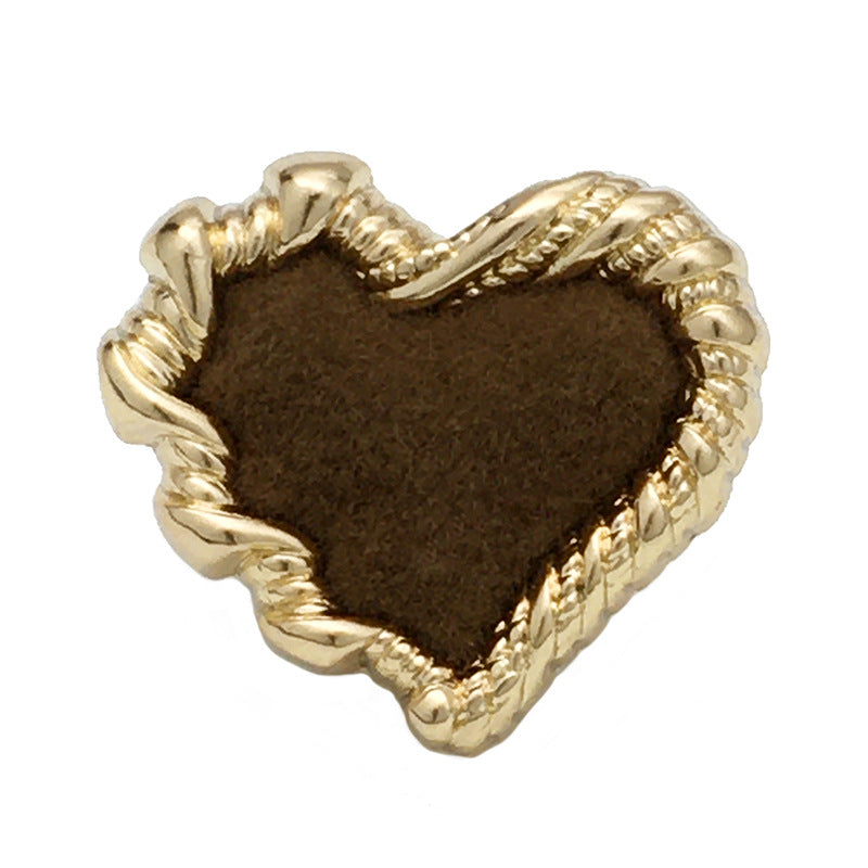 Brown heart-shaped button with velvet front and gold-tone metal edge