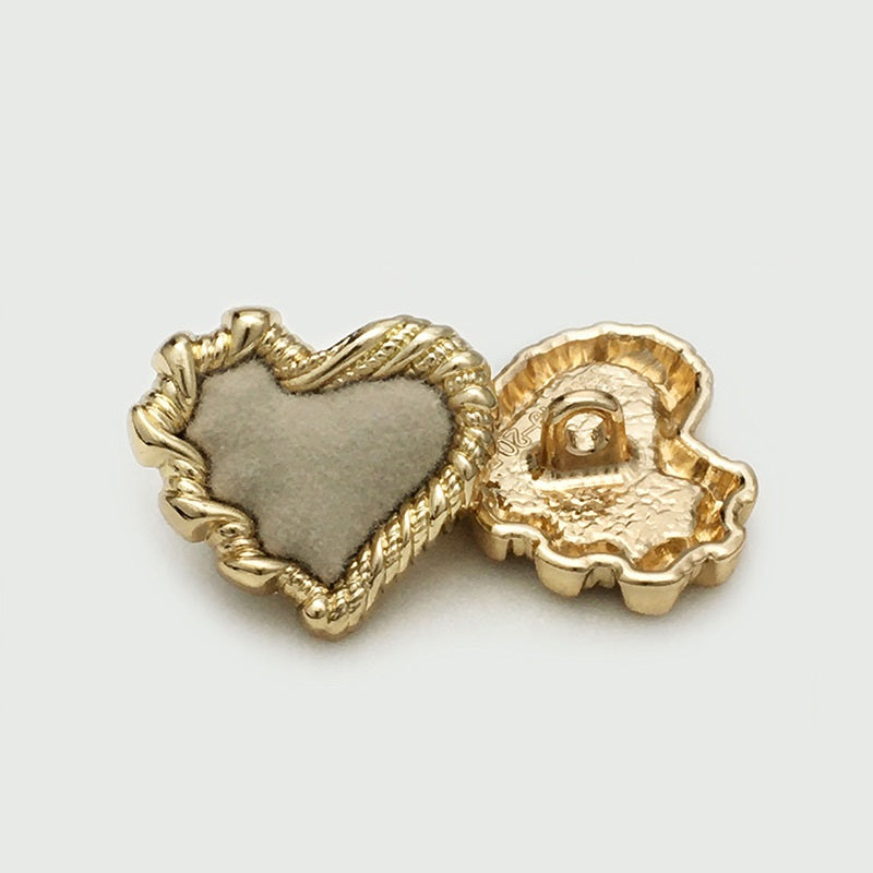 Heart button with grey velvet front and gold-tone shank backing