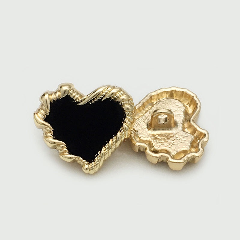 Heart button with black velvet front and gold-tone shank backing