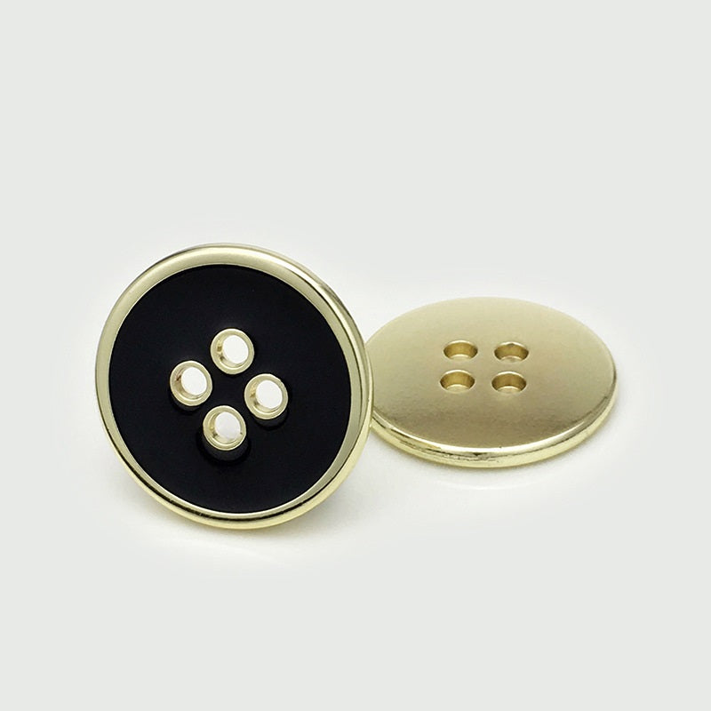 Round four-hole button pair: black face with gold rim and gold back plate