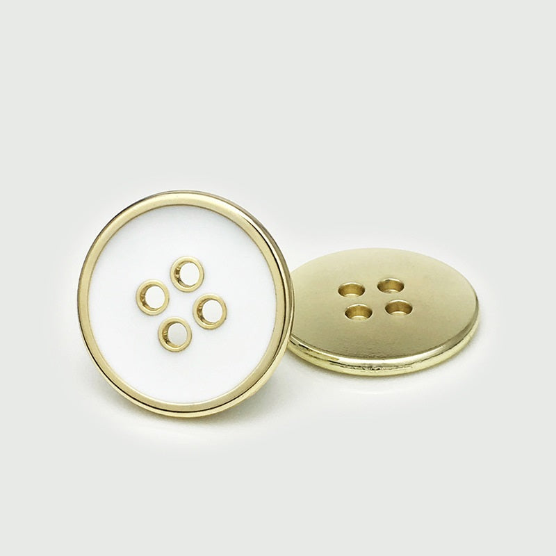 Round four-hole metal button, white face with gold rim and four-hole back