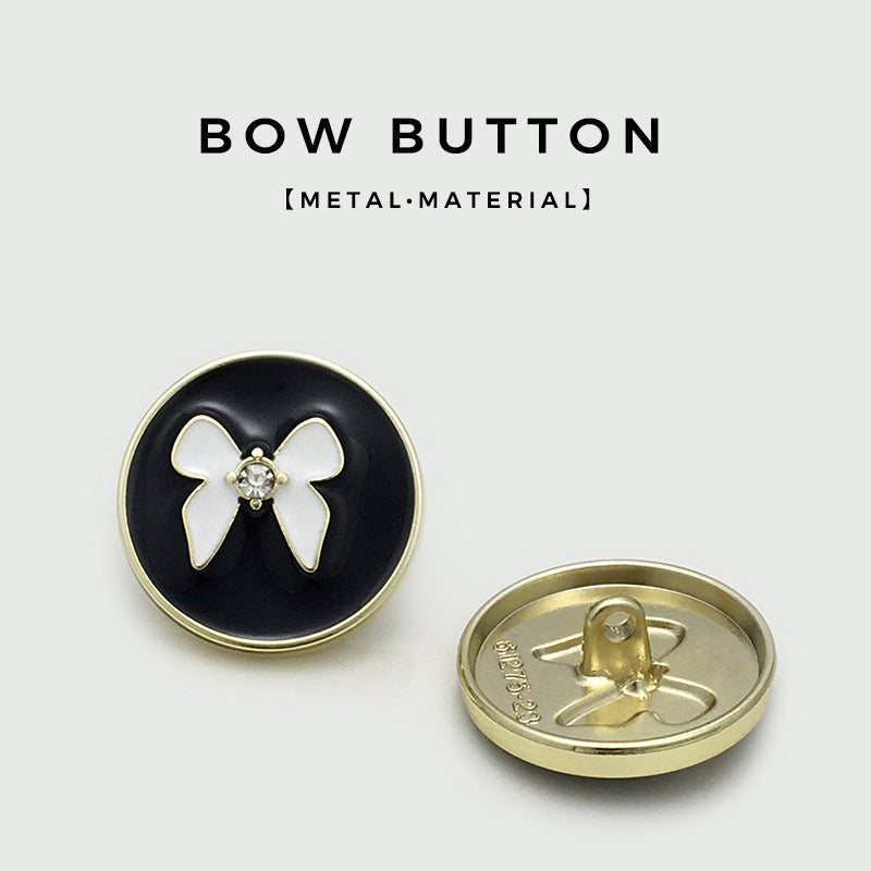 Round metal bowknot button front and back: black enamel, white bow, gold-tone base