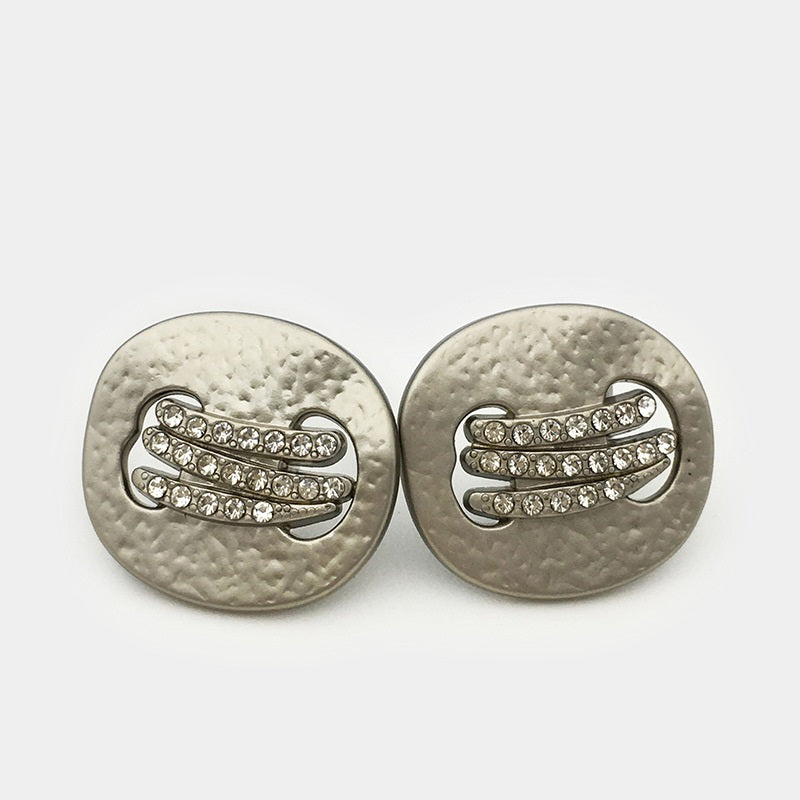 Pair of silver irregular metal buttons with diamond rhinestone center and decorative bars