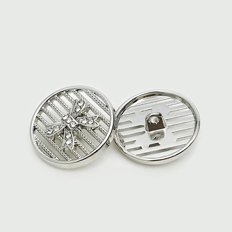 Silver 25mm bowtie metal button, gem starburst front with rhinestones and ridged reverse.