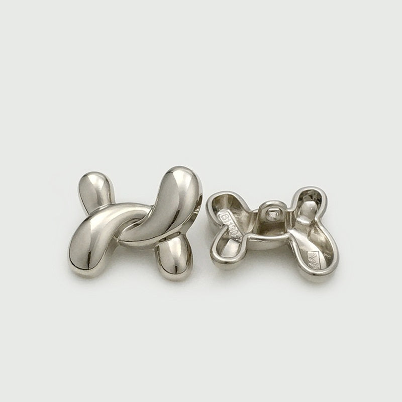 Irregular X-shaped metal buttons, silver tone, back view with clasp