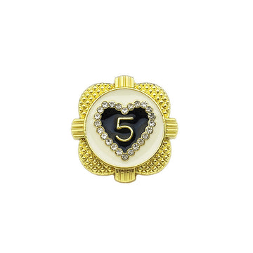 Gold heart-shaped metal button with rhinestone border and '5' center