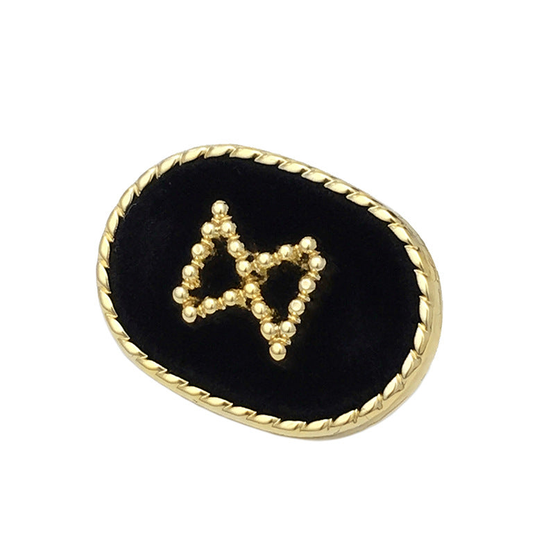 Oval velvet metal button, black with gold bead X design and gold braided edge
