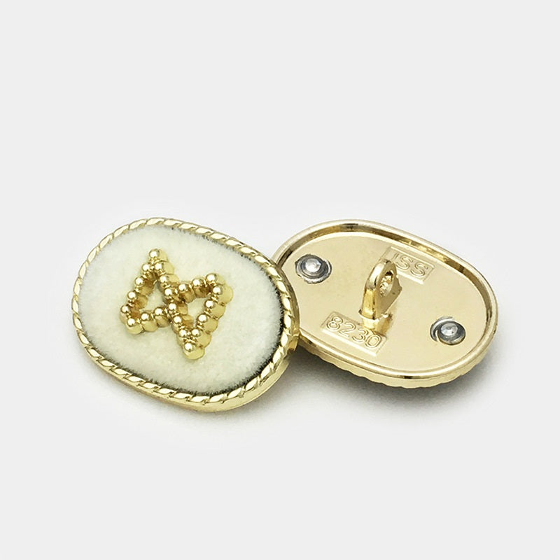 Oval velvet metal button, white front with gold bead motif and metal shank back