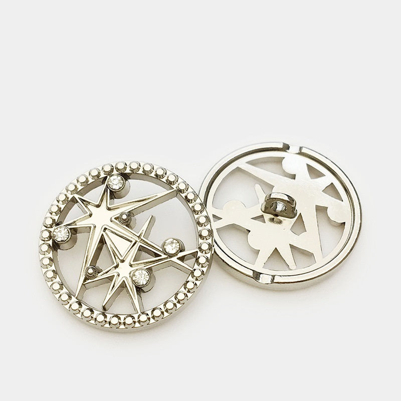 Silver round metal button, front and back with hollow star cutout and rhinestone detail