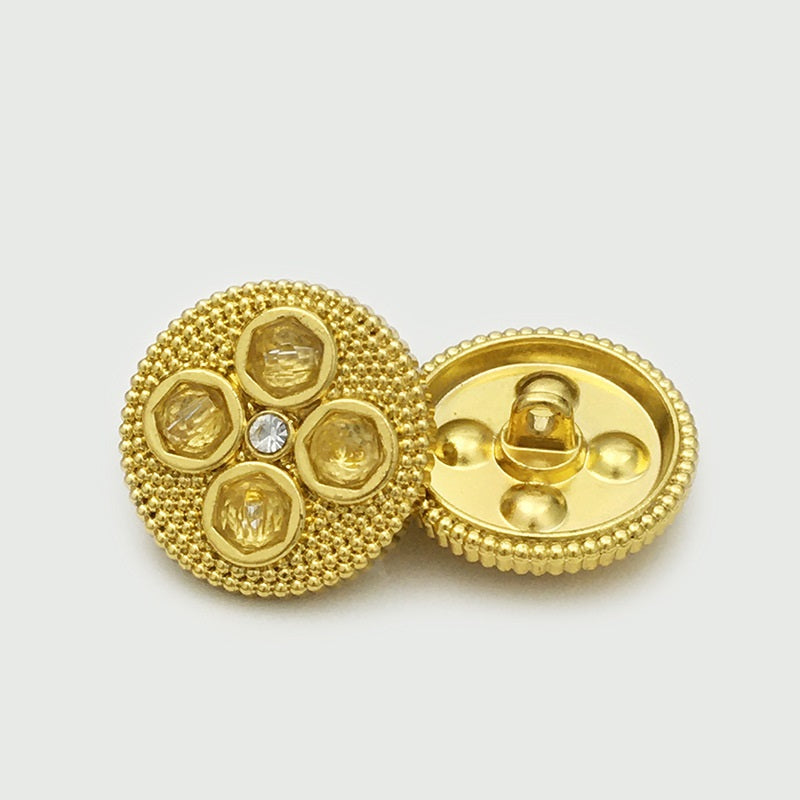 Gold four-leaf clover diamond metal button with pin back and faceted inset stones.