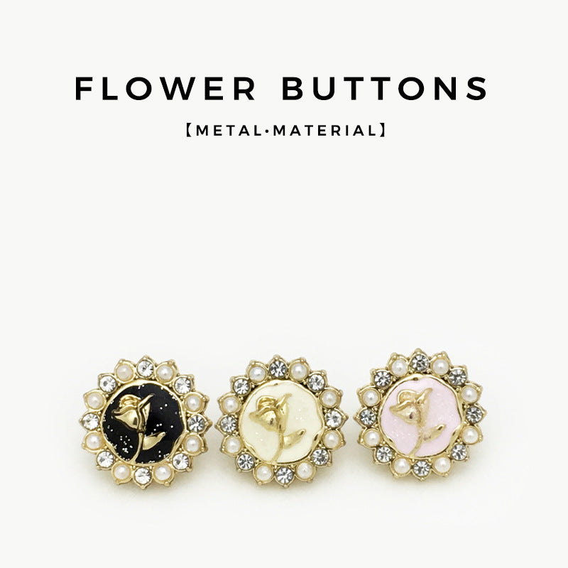 Three flower shirt buttons: black, white, and pink centers with pearls and rhinestones