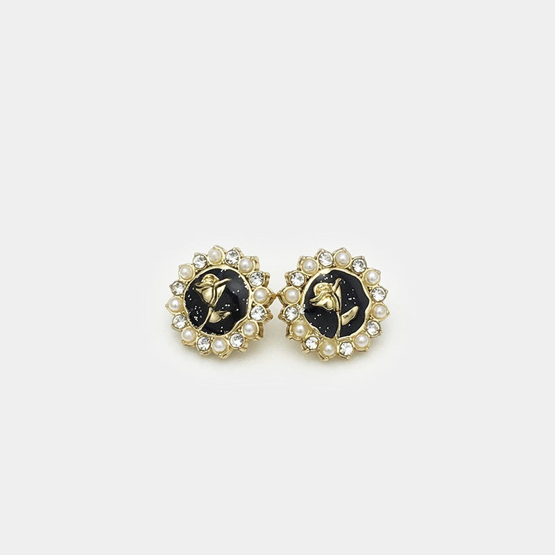 Pair of black flower shirt buttons with gold bird, faux pearls and clear rhinestones