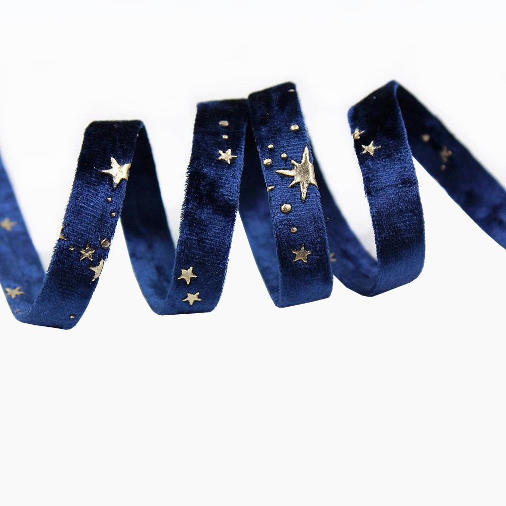 Blue velvet ribbon with gold star embroidery, curled strips