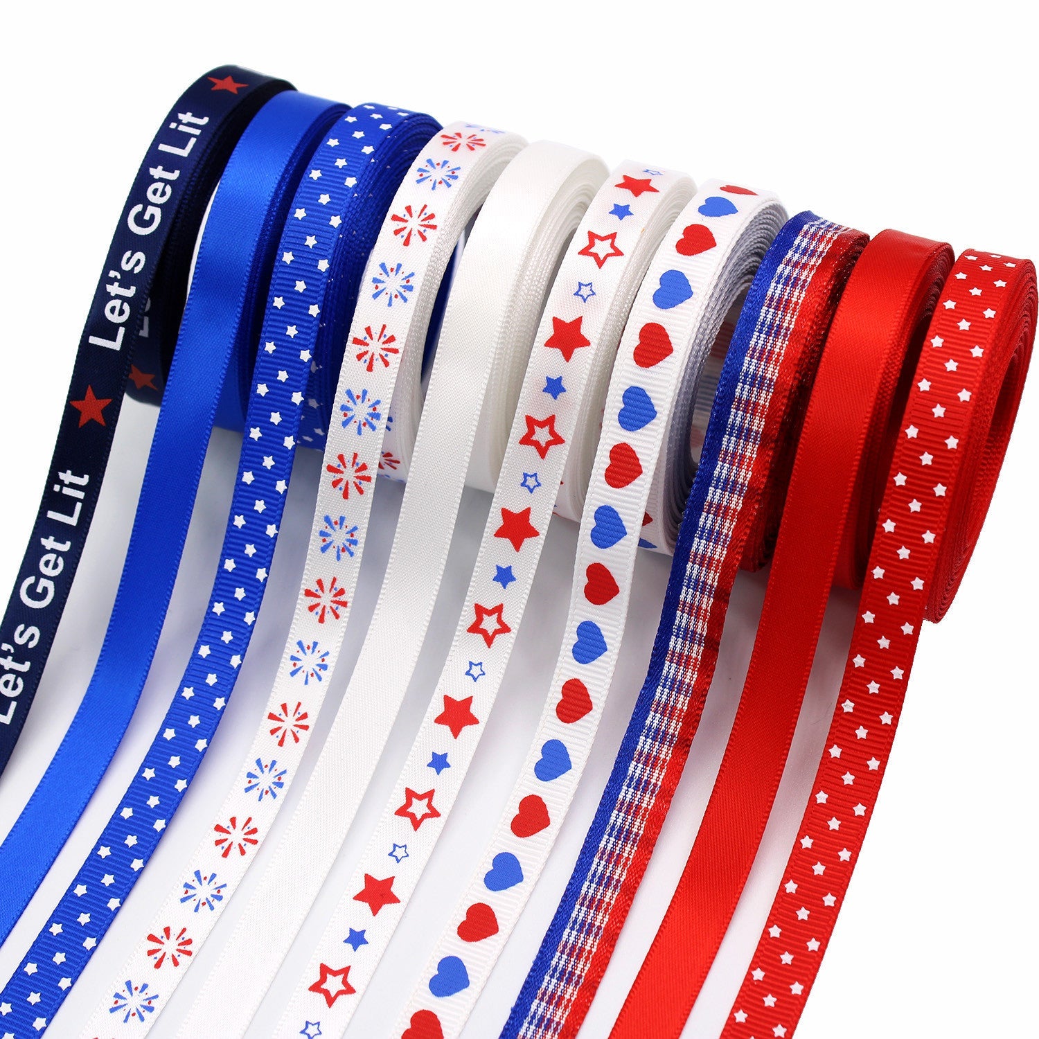 Stacked ribbon rolls: blue, white and red with star and heart patterns