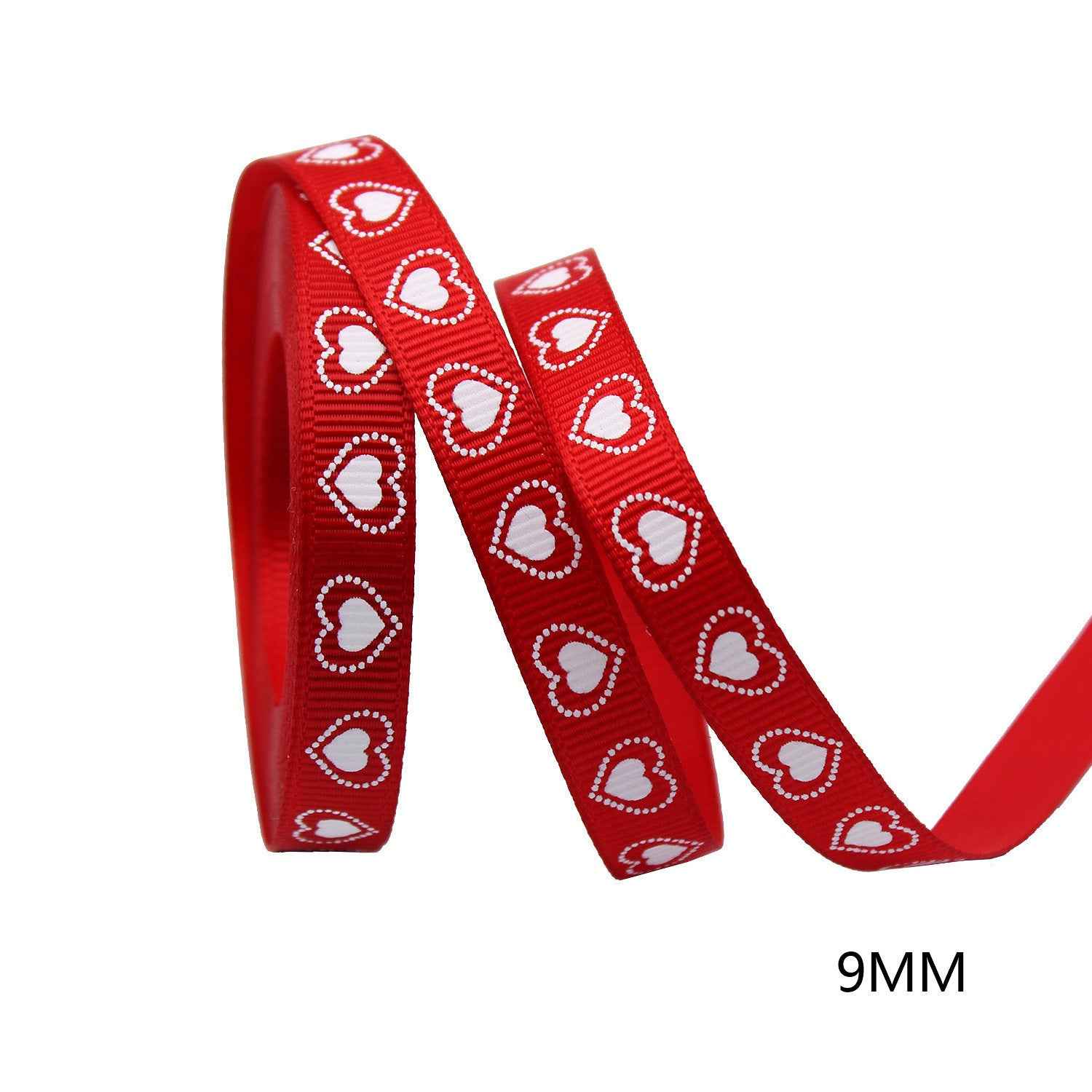 9mm red ribbon with white heart pattern, looped roll and curled strand