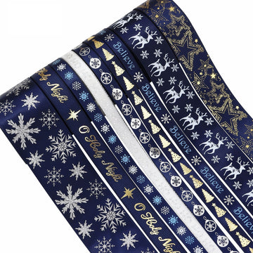 Christmas ribbon roll, navy with white snowflakes, reindeer, stars, and gold accents